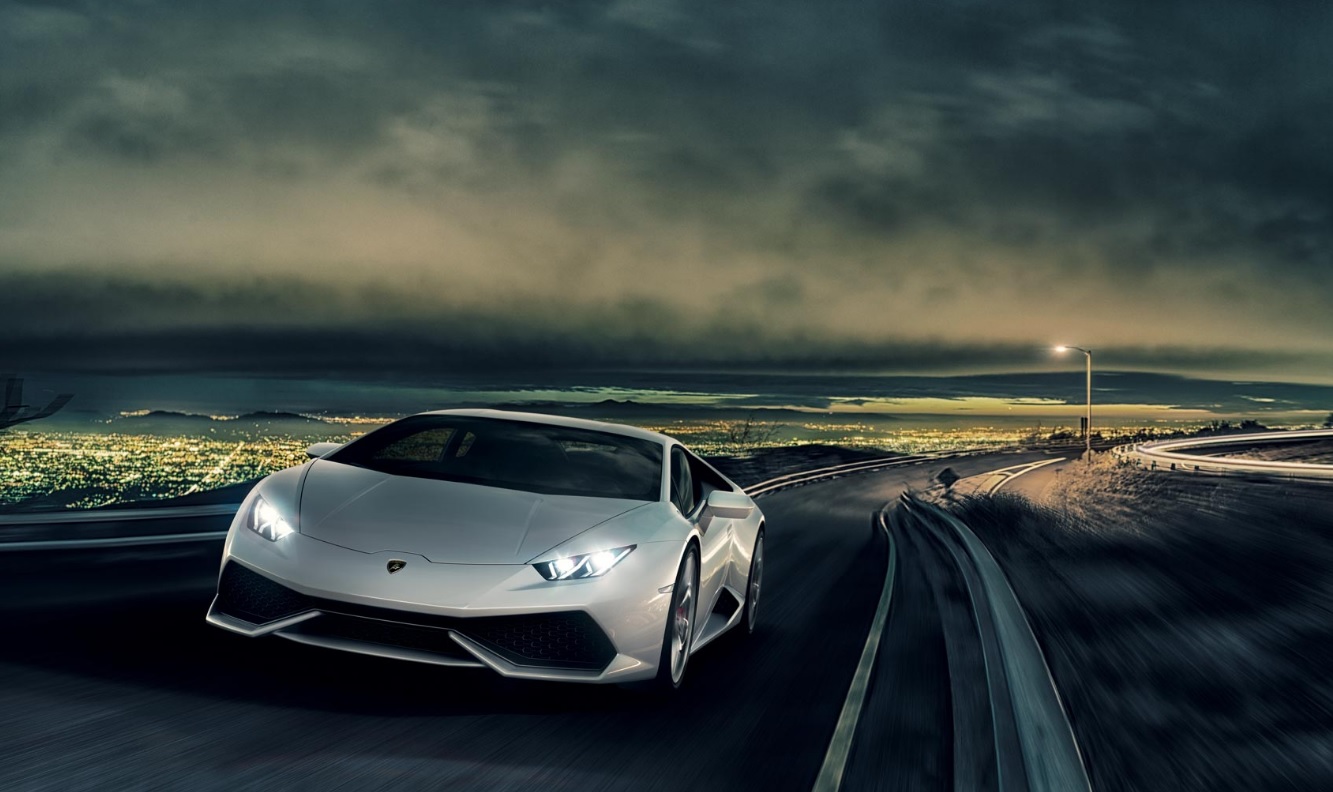 Lamborghini Huracán jadący w nocy po ulicy